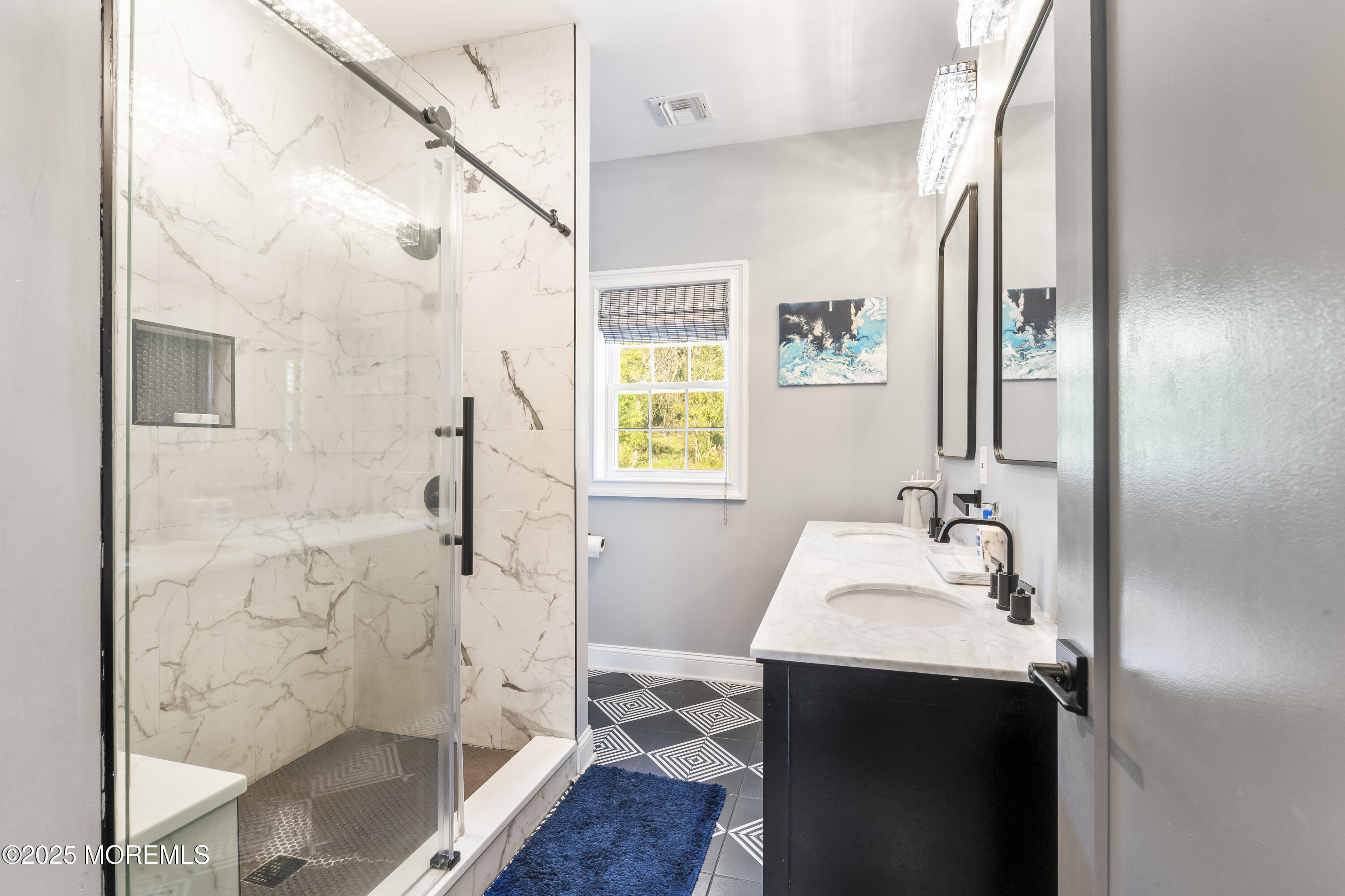 832 Holmdel Road Holmdel, NJ 07733 - Photo 35 of 44 a bathroom with a sink a mirror and a shower