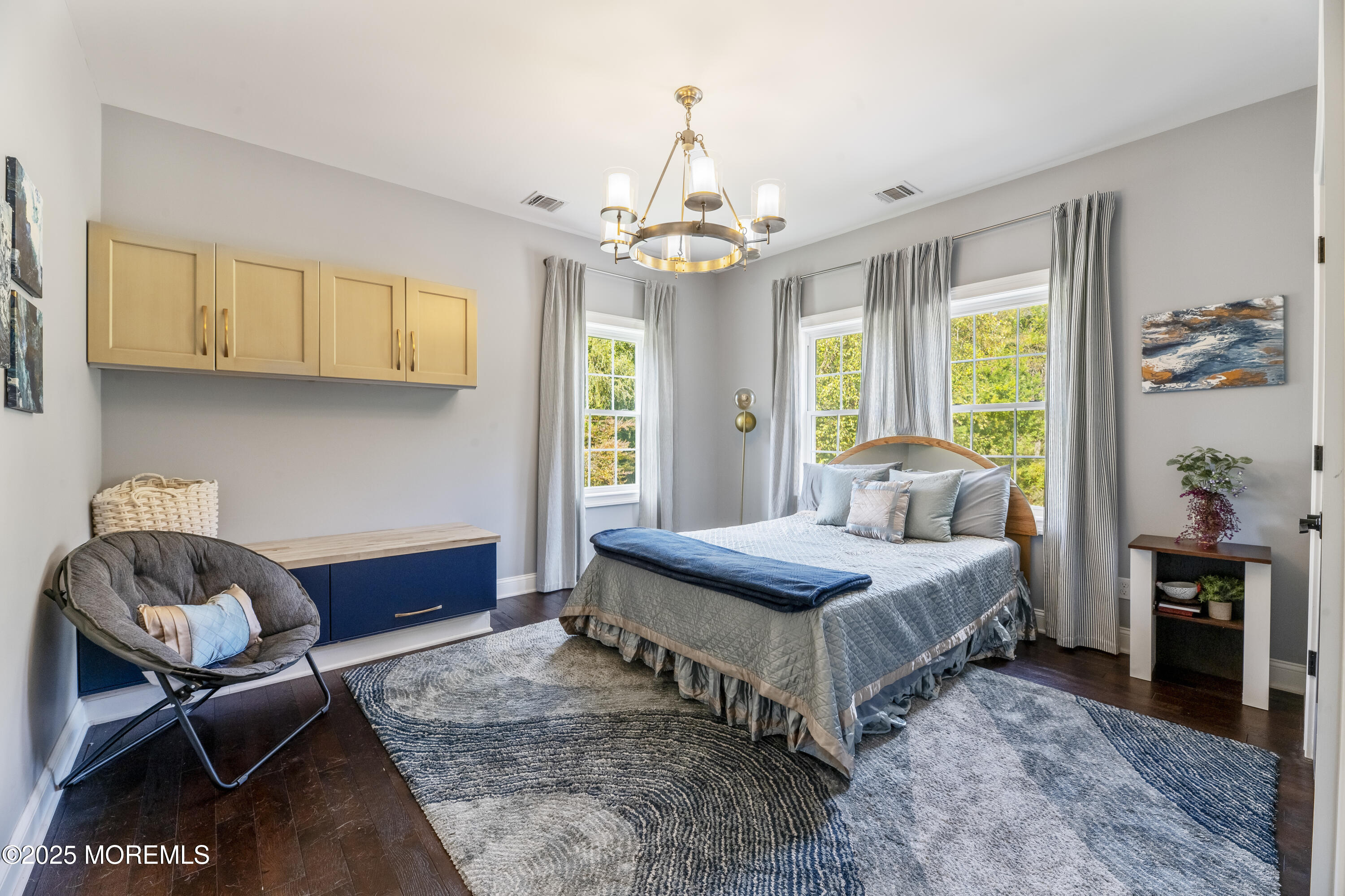 832 Holmdel Road Holmdel, NJ 07733 - Photo 36 of 44 a bedroom with a bed and a chandelier