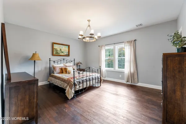 a bed room with a bed and a window
