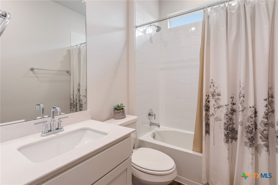 205 Charles Trail Georgetown, TX 78626 - Photo 17 of 38 a bathroom with a sink toilet and shower