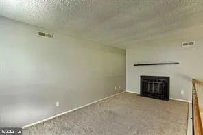 a view of a livingroom with fireplace