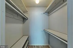 a view of an empty room with a fireplace