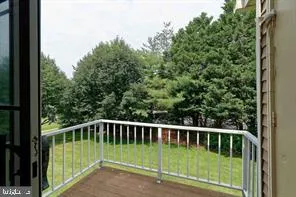 a view of a yard with a wooden fence