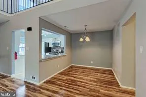 a view of a kitchen stairs and an empty room