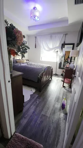 a bathroom with a sink mirror and shower
