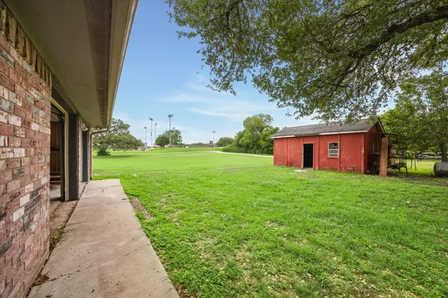 a view of a back yard with green space