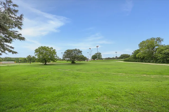 a backyard of a house with lots of green space