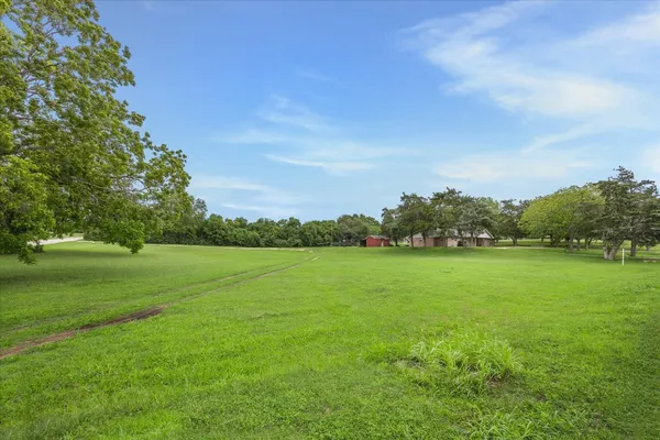 a view of field with ocean view