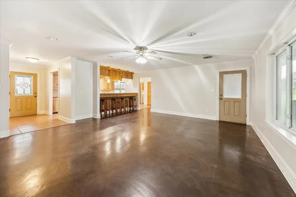 wooden floor in an empty room with a window