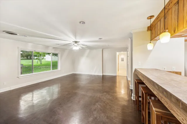 a view of a kitchen with a sink and a window