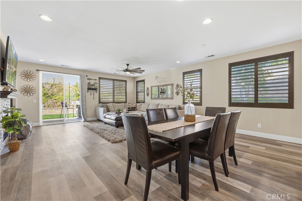 24903 Shadow Ridge Court Valencia, CA 91354 - Photo 15 of 43 a view of a dining room with furniture window and wooden floor