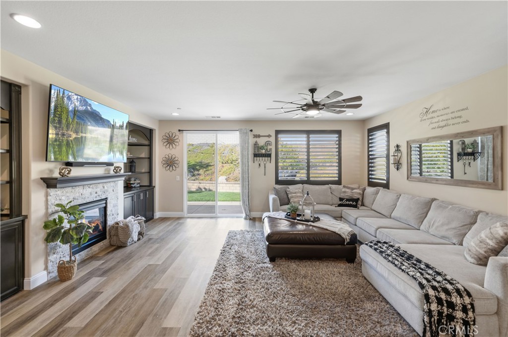 24903 Shadow Ridge Court Valencia, CA 91354 - Photo 19 of 43 a living room with furniture and a fireplace