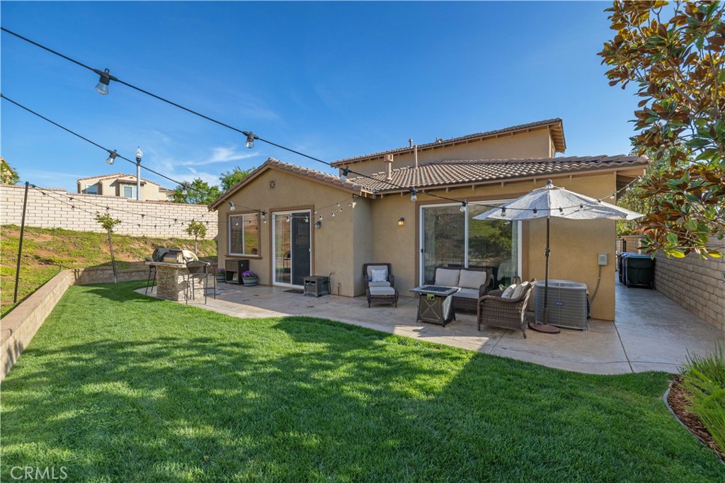 24903 Shadow Ridge Court Valencia, CA 91354 - Photo 37 of 43 a view of a house with backyard porch and sitting area