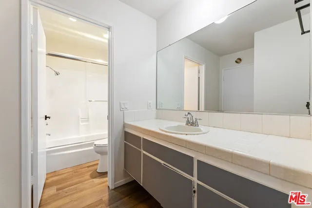 a bathroom with a shower and a toilet