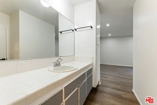 a view of an empty room with a fireplace and a floor to ceiling window