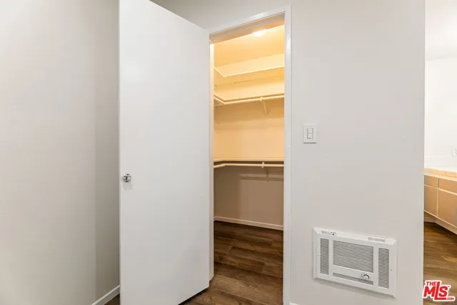 a bathroom with a shower a toilet and a shower