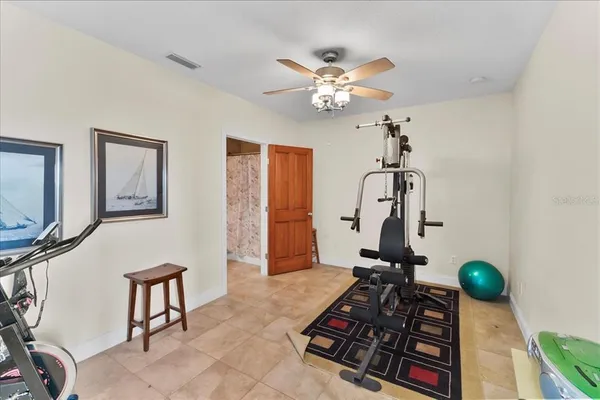 a very nice looking room with a big mirror and a flat screen tv