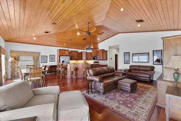 a living room with lots of furniture and a chandelier