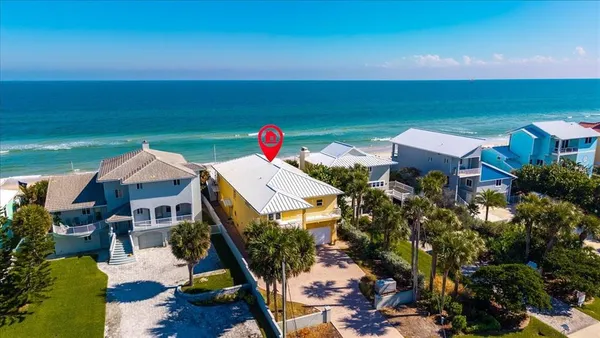 a view of a house with a yard and lake view