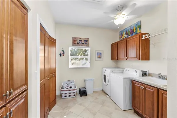 a living room with furniture a table and wooden floor