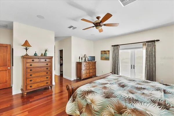 a bathroom with a tub and sink mirror
