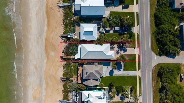 an aerial view of a house with outdoor space