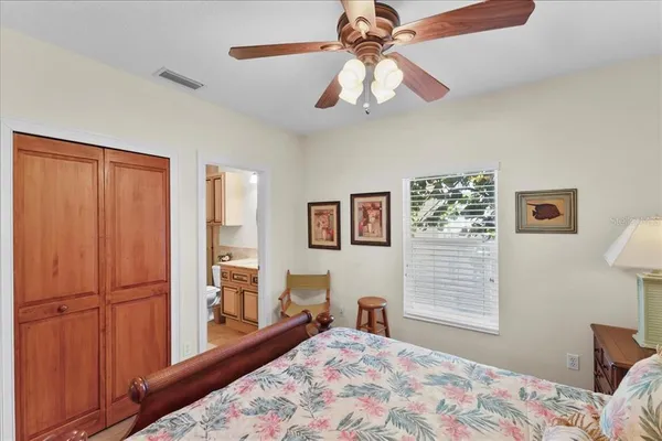 a bedroom with furniture and a window