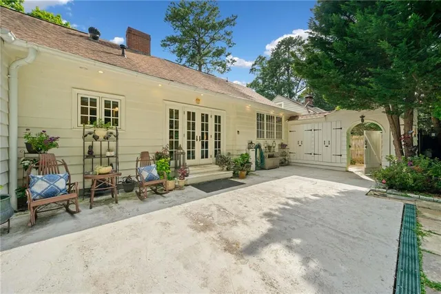 a backyard of a house with outdoor seating