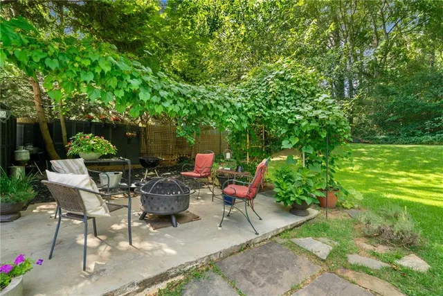 a view of chair and tables in the garden
