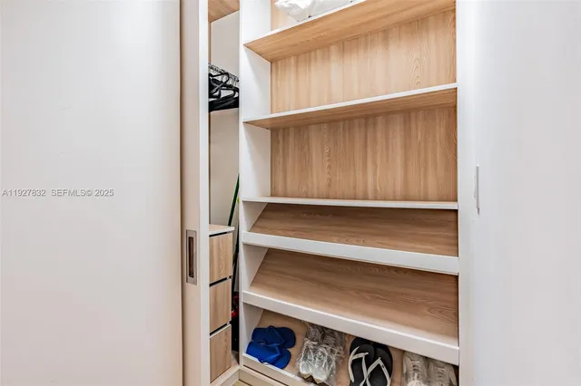 a bedroom with a bed and a cabinets