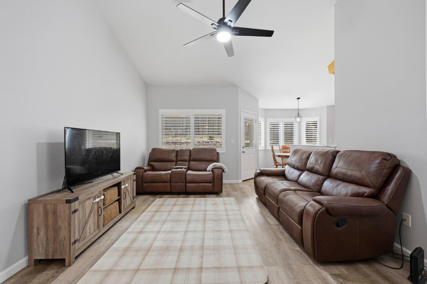 5013 Charter Road Rocklin, CA 95765 - Photo 9 of 35 a living room with furniture and a flat screen tv
