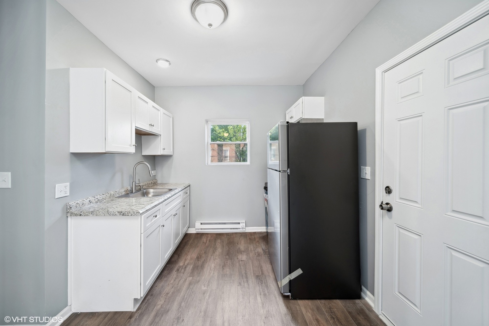 6601 South Green Street, Unit 2 Chicago, IL 60621 - Photo 5 of 11 a kitchen with a refrigerator and a sink