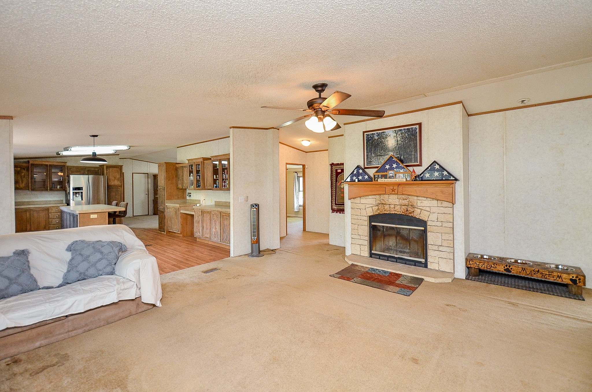 5440 7th Street Sheridan, TX 77475 - Photo 14 of 37 a living room with furniture and a fireplace