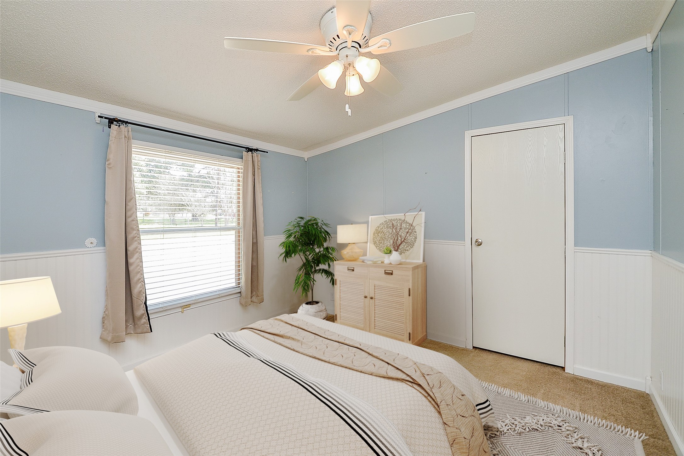 5440 7th Street Sheridan, TX 77475 - Photo 20 of 37 a bedroom with a bed and a chandelier
