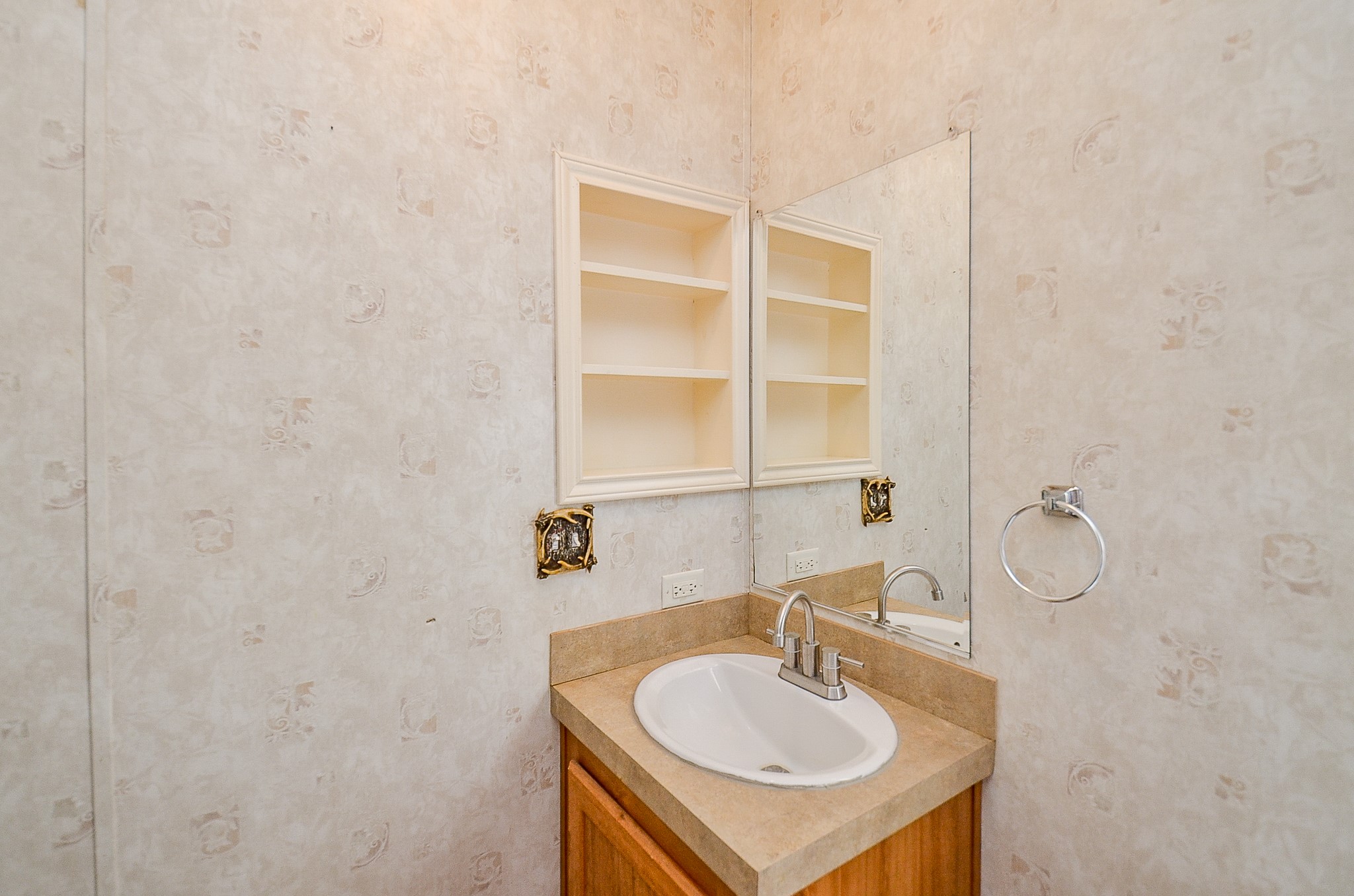 5440 7th Street Sheridan, TX 77475 - Photo 23 of 37 a bathroom with a sink and a mirror