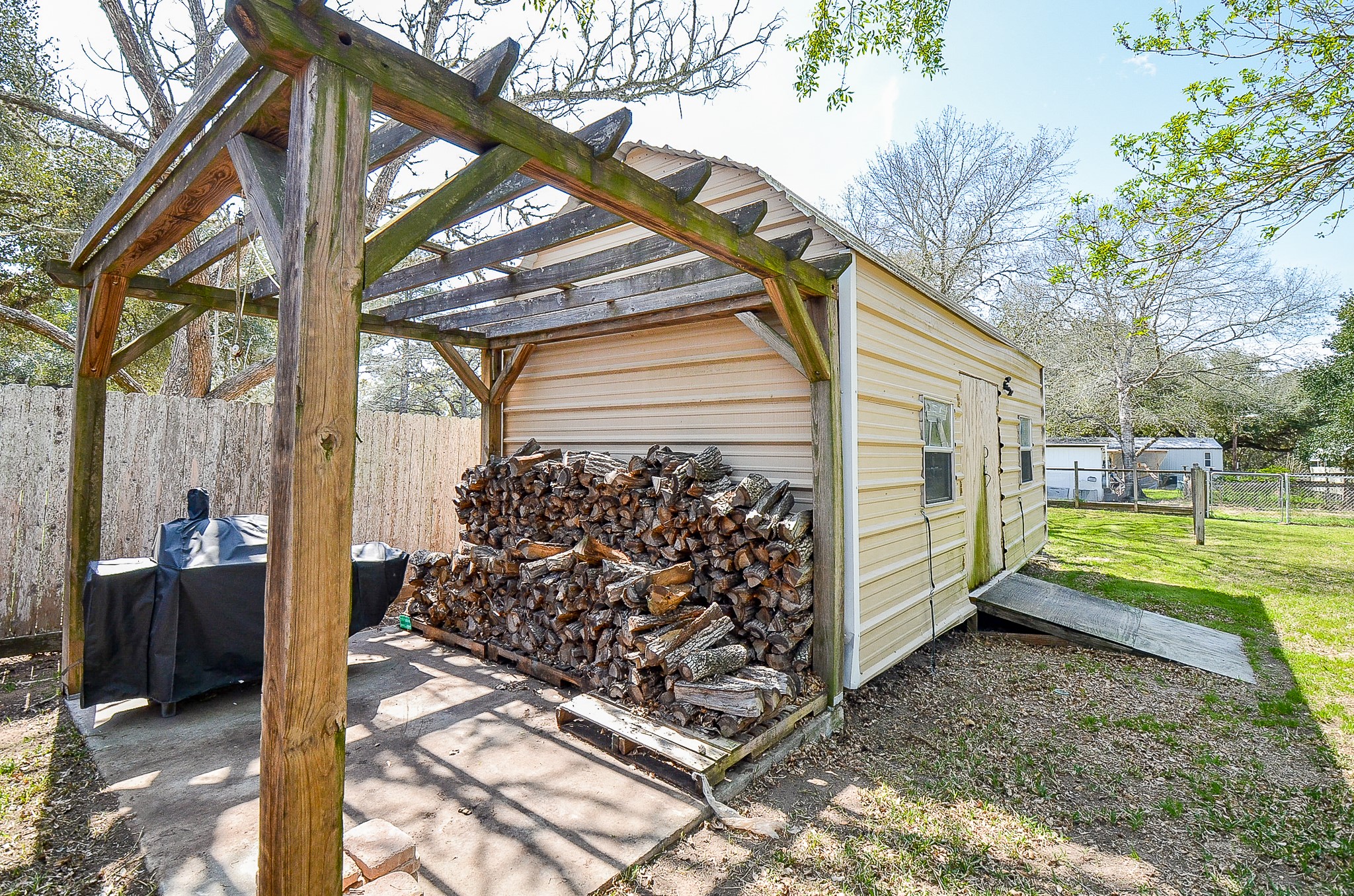 5440 7th Street Sheridan, TX 77475 - Photo 29 of 37 a view of a house with a yard