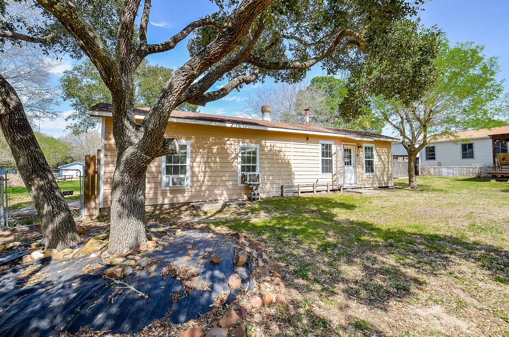 5440 7th Street Sheridan, TX 77475 - Photo 30 of 37 a view of a house with a large tree