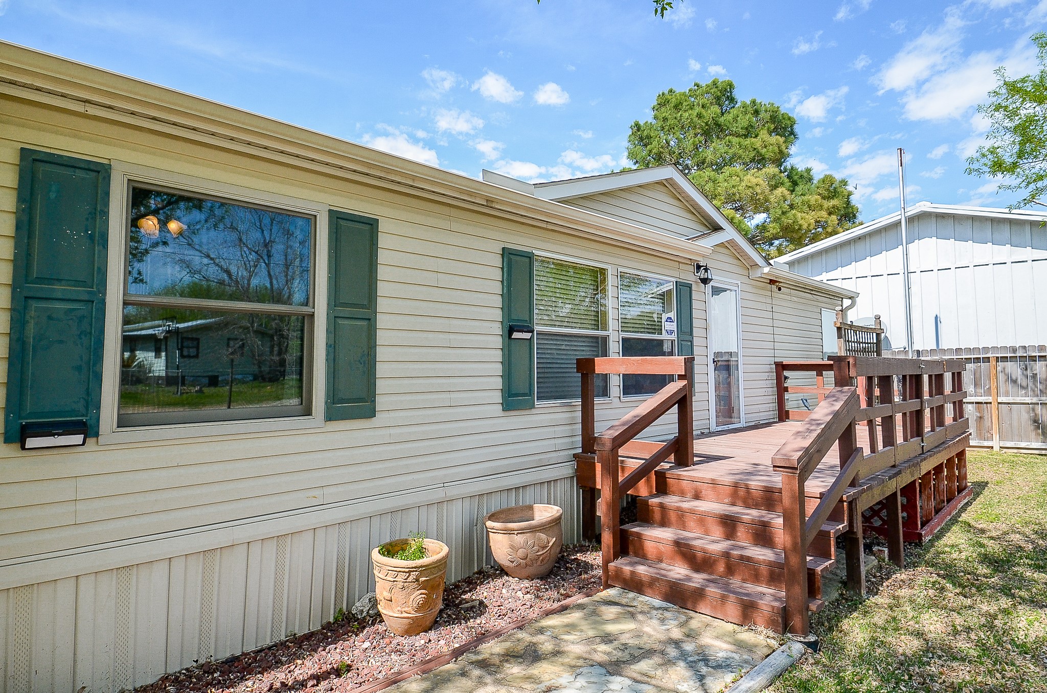 5440 7th Street Sheridan, TX 77475 - Photo 3 of 37 a view of a wooden deck with a backyard