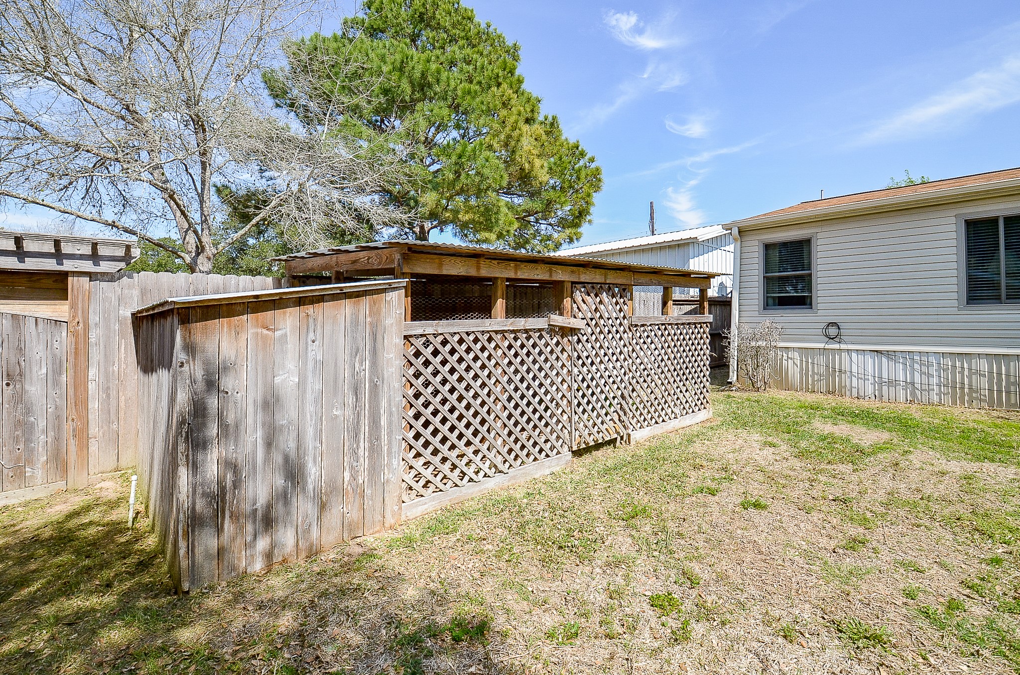 5440 7th Street Sheridan, TX 77475 - Photo 32 of 37 a view of back yard of the house