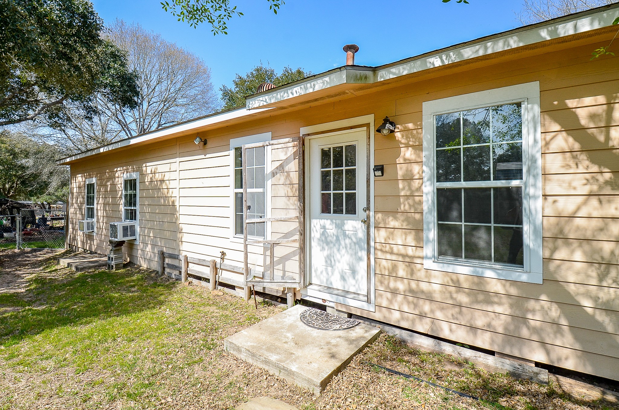 5440 7th Street Sheridan, TX 77475 - Photo 33 of 37 a front view of a house with a yard