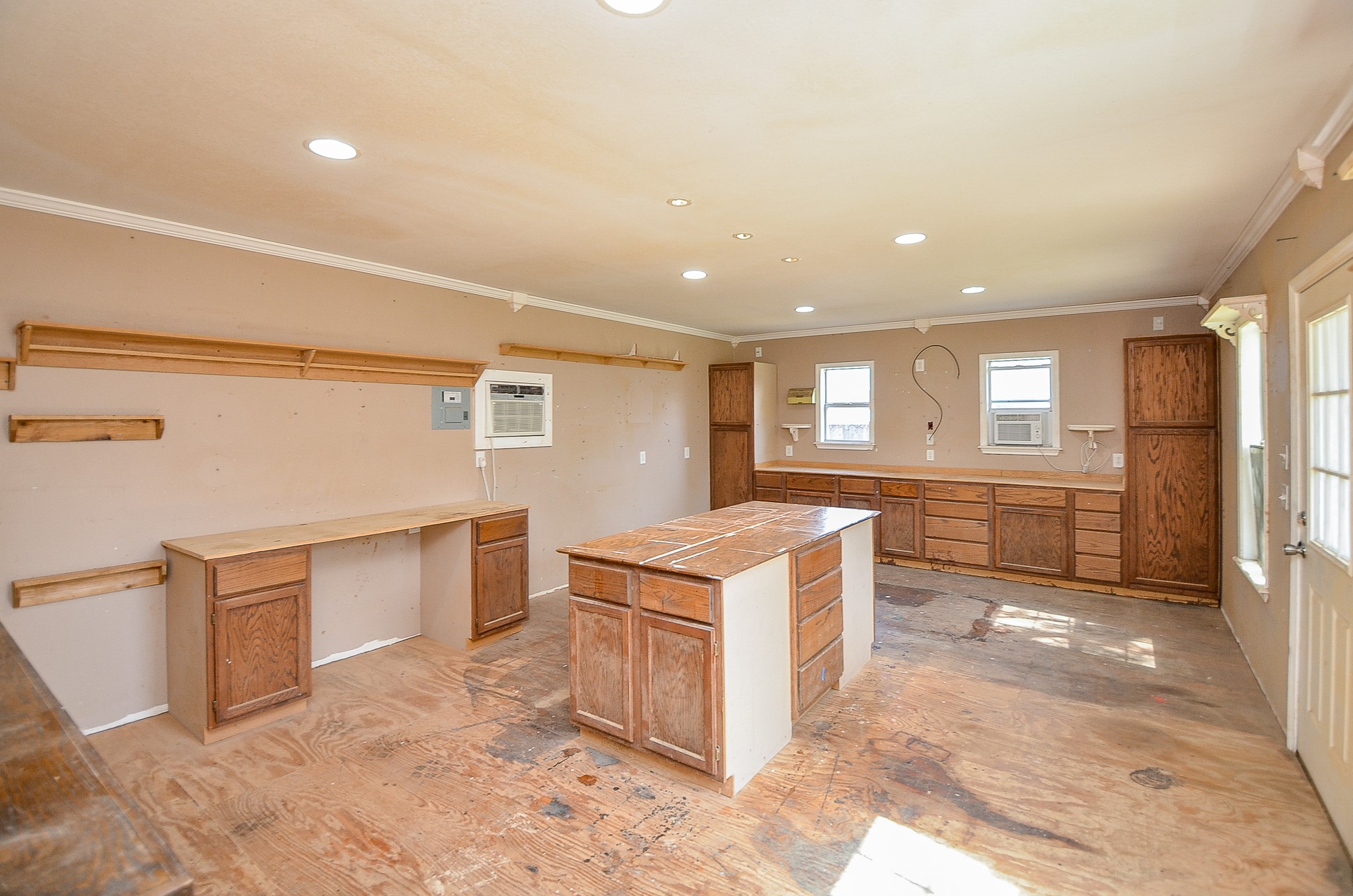 5440 7th Street Sheridan, TX 77475 - Photo 35 of 37 a kitchen with a stove a refrigerator and cabinets
