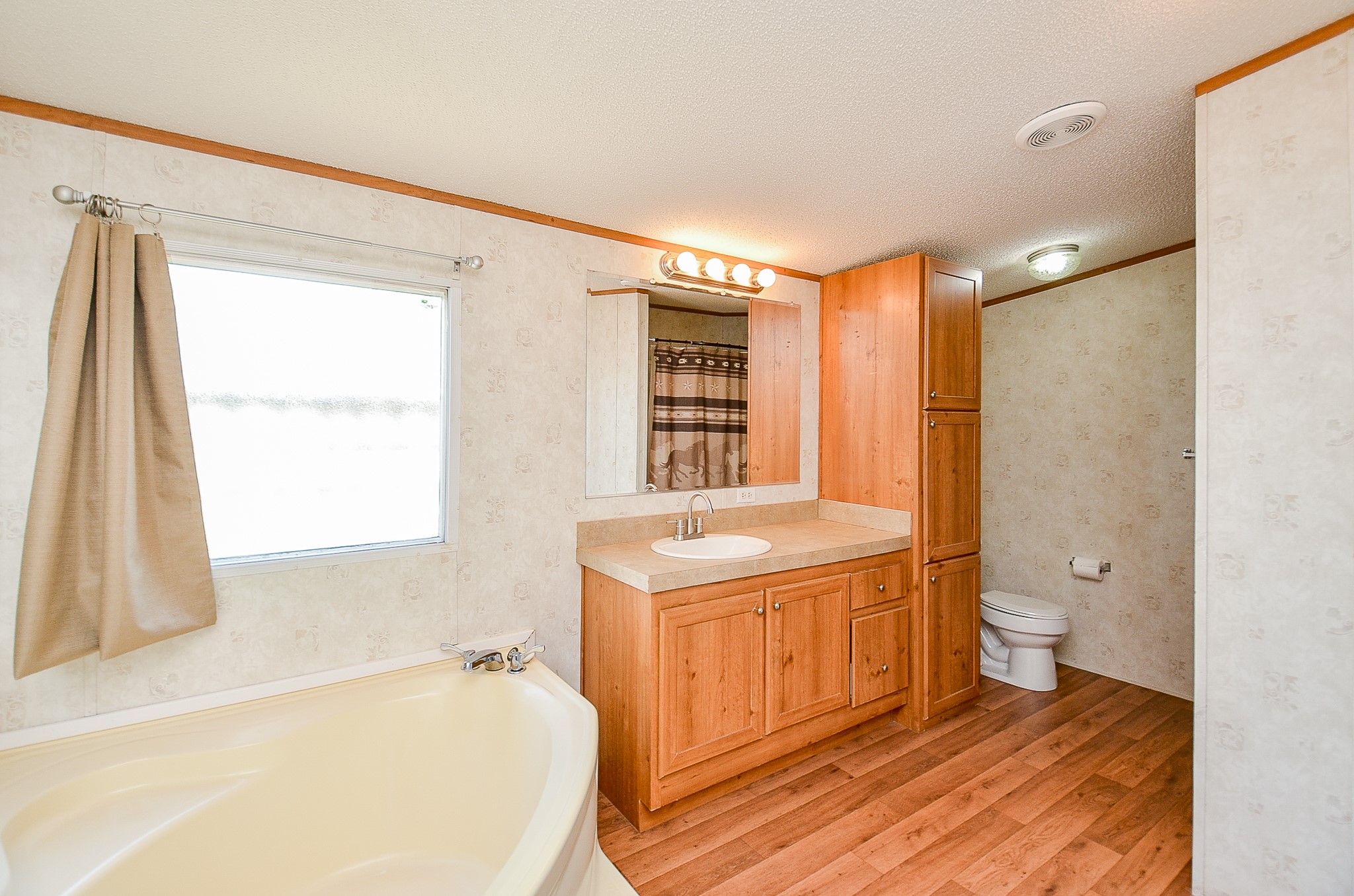 5440 7th Street Sheridan, TX 77475 - Photo 8 of 37 a bathroom with a granite countertop sink toilet and shower