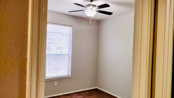 a view of a hallway with a window