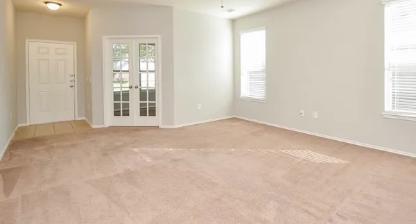 an empty room with windows