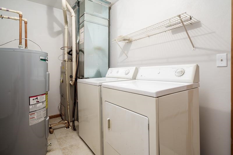 10135 Monarch Road, Unit 4 120D Roscoe, IL 61073 - Photo 19 of 26 a utility room with dryer and washer