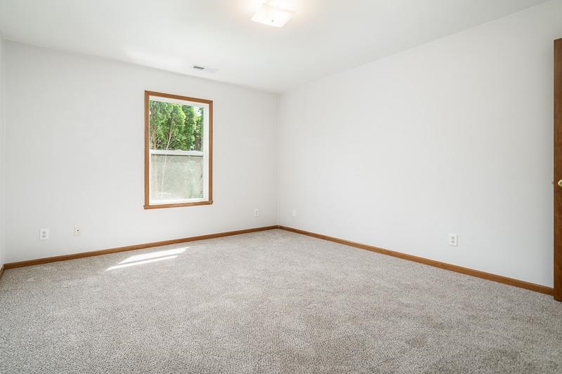 10135 Monarch Road, Unit 4 120D Roscoe, IL 61073 - Photo 23 of 26 an empty room with a window
