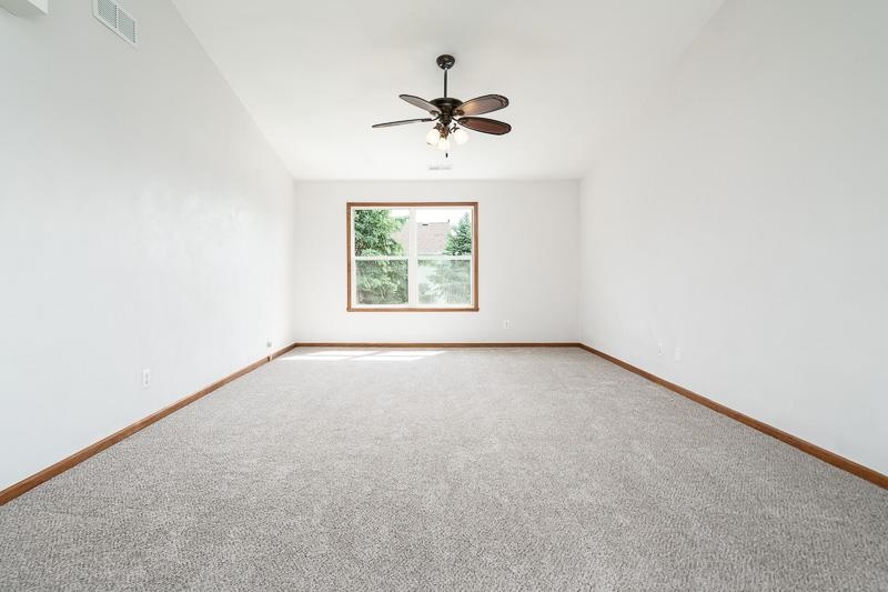 10135 Monarch Road, Unit 4 120D Roscoe, IL 61073 - Photo 7 of 26 an empty room with a window