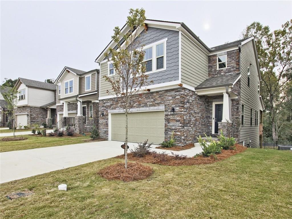 3305 Morgan Road Buford, GA 30519 - Photo 1 of 1 a front view of a house with a yard
