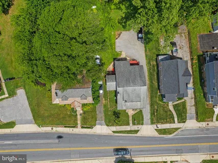 a view of a house with a sink and wooden fence