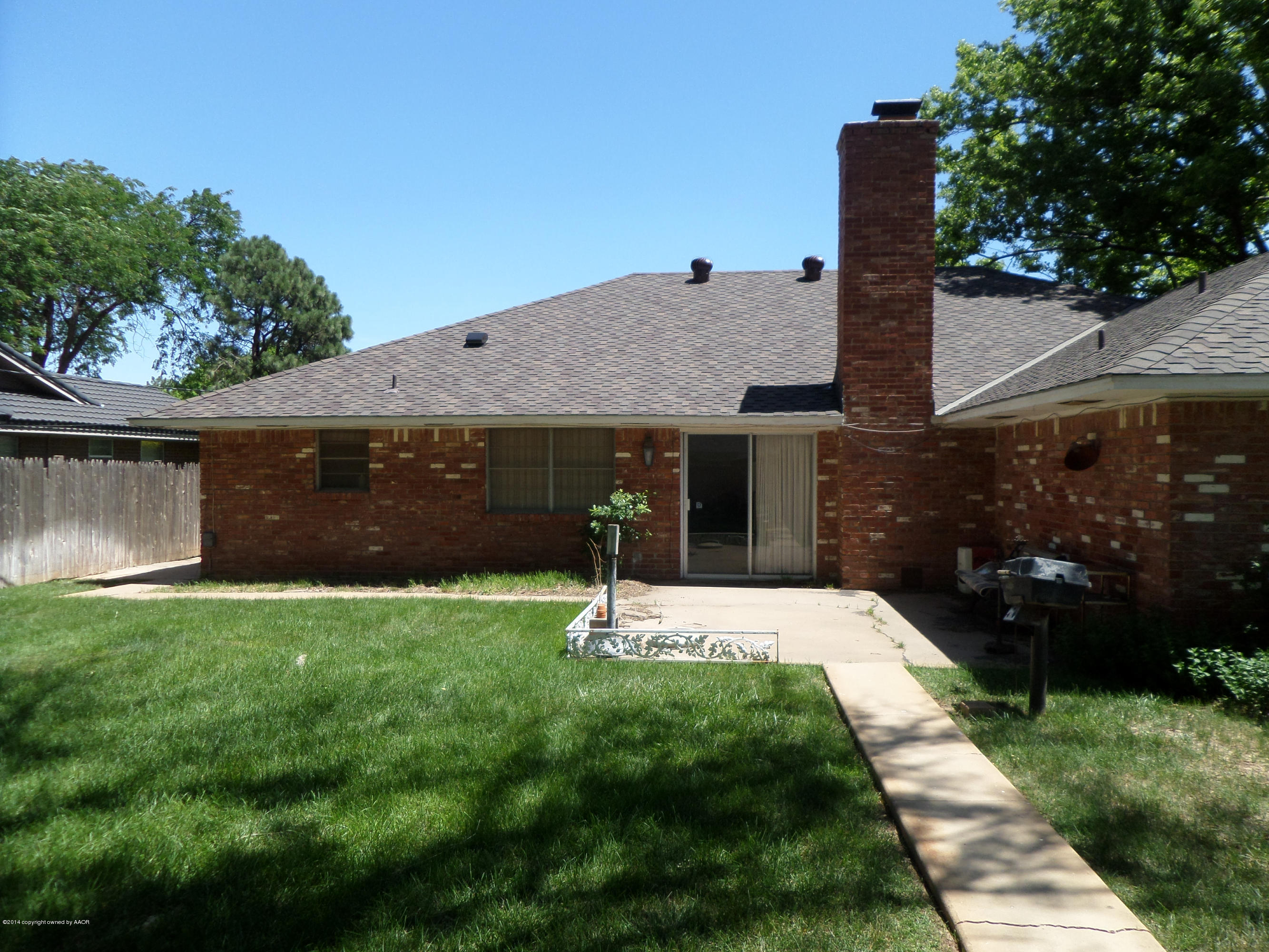 6911 Calumet Road Amarillo, TX 79106 - Photo 6 of 8 a view of a house with backyard and garden